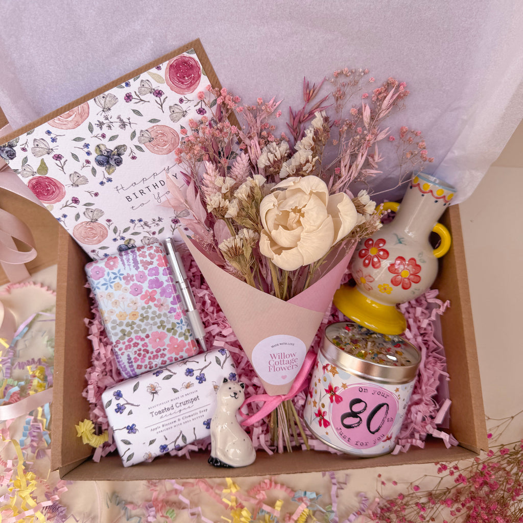 Gift box with flowers, candle, notebook, soap and vase for 80th birthday