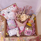 Gift box with flowers, candle, notebook, soap and vase for 80th birthday