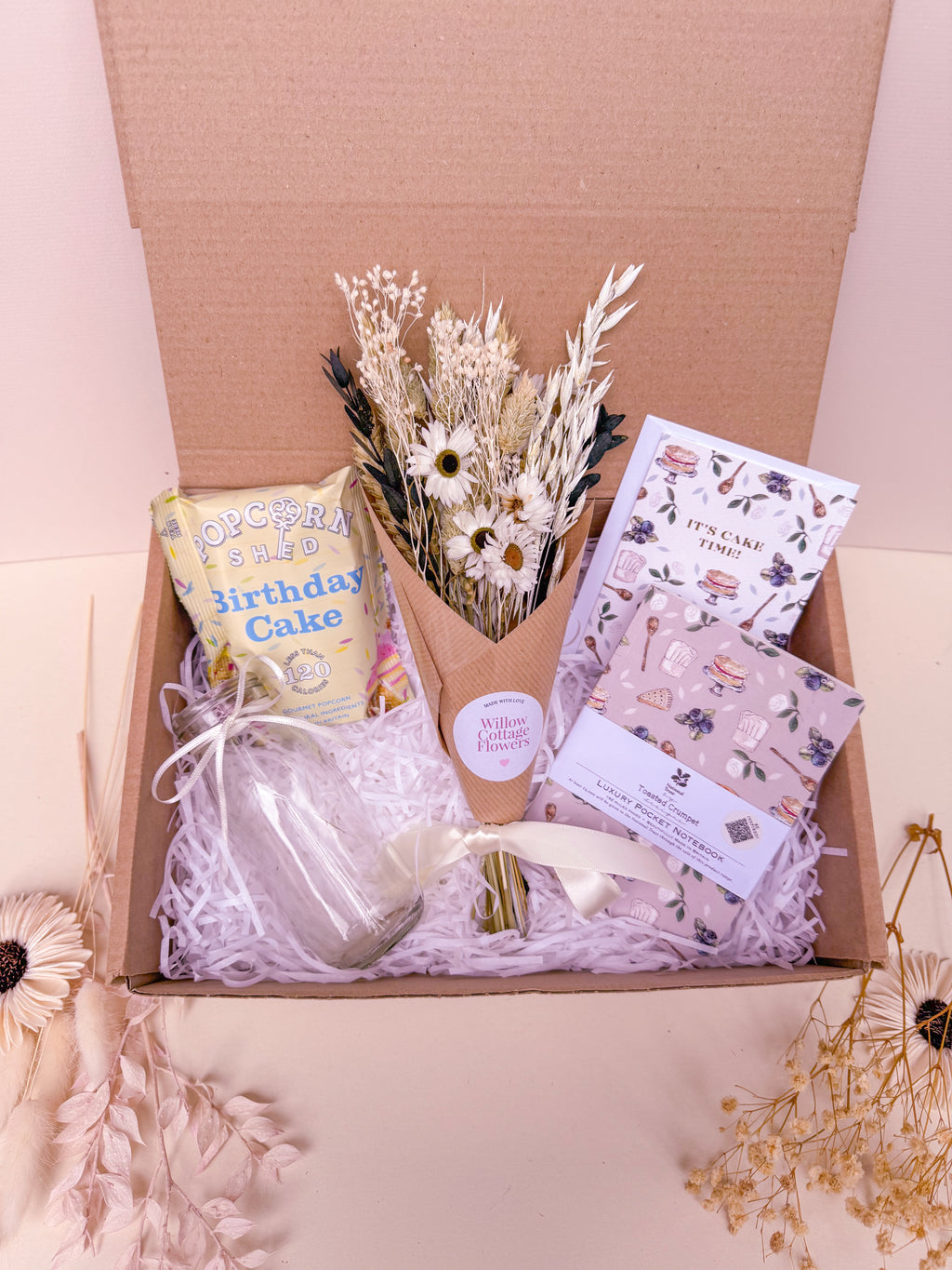 birthday cake theme gift box with dried flowers, notebook and popcorn