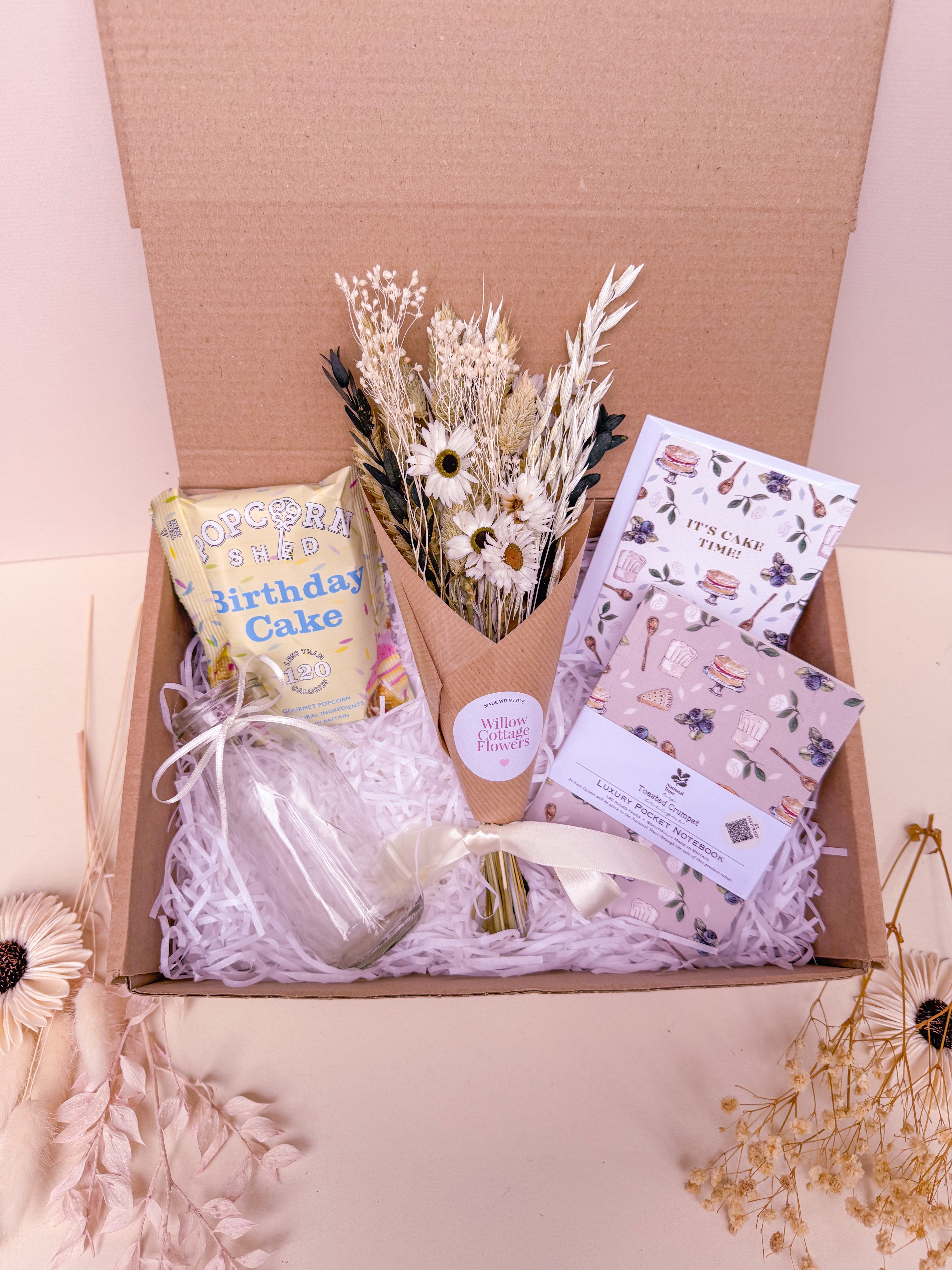 birthday cake theme gift box with dried flowers, notebook and popcorn