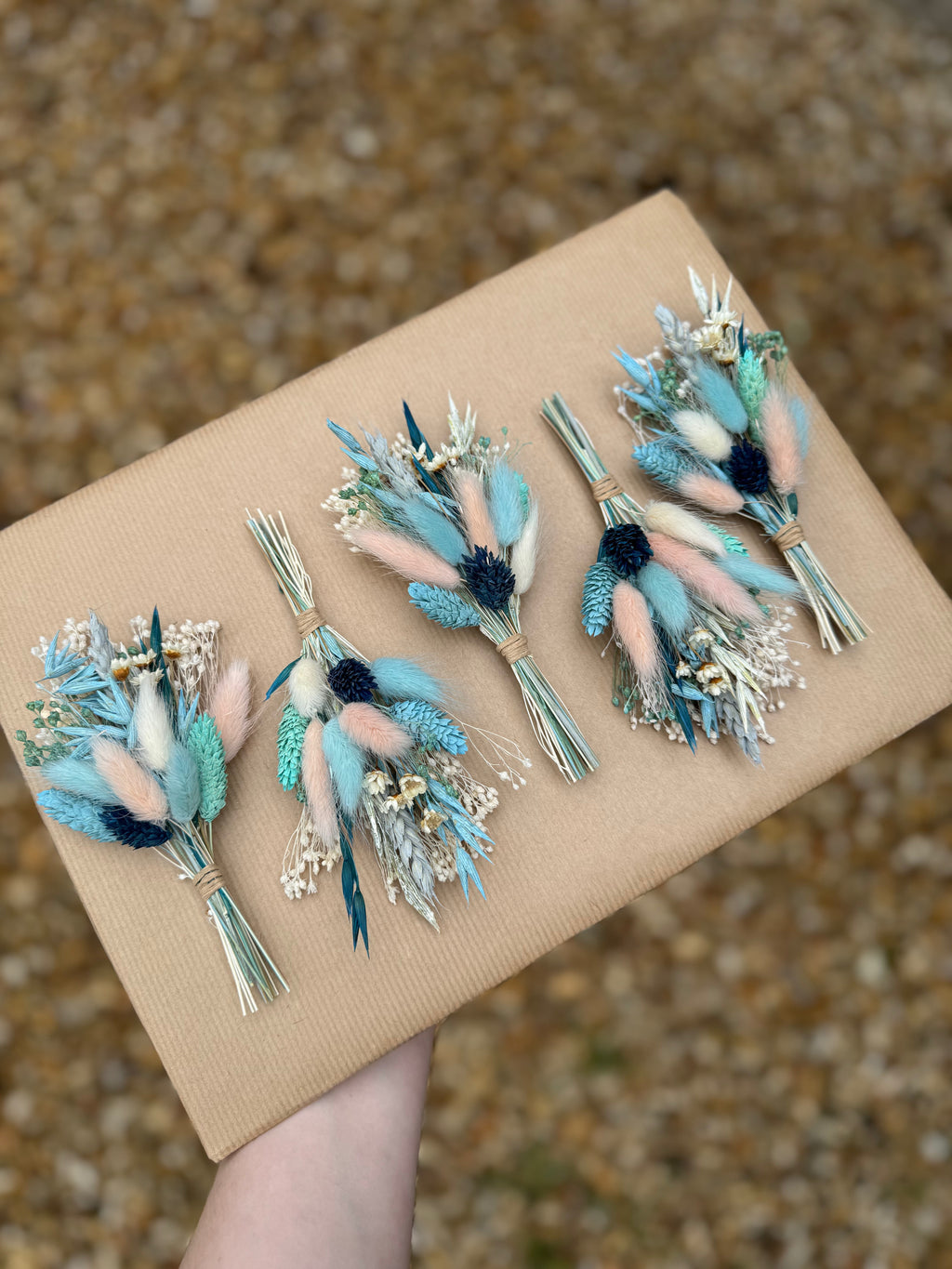 blue and pink floral boutonniere