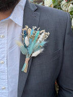 blue boutonniere with bunny tails