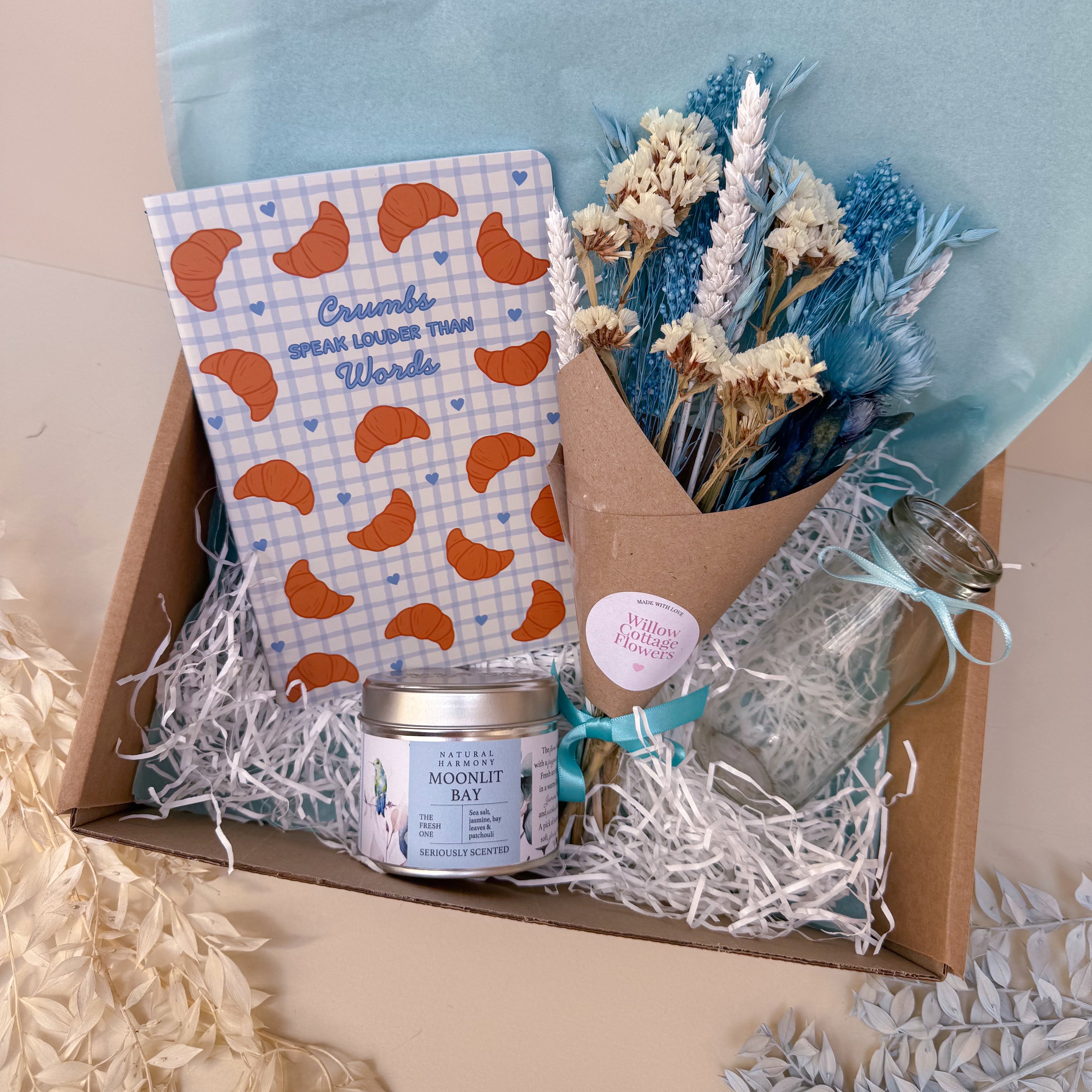 blue gift hamper with luxury candle in gift box
