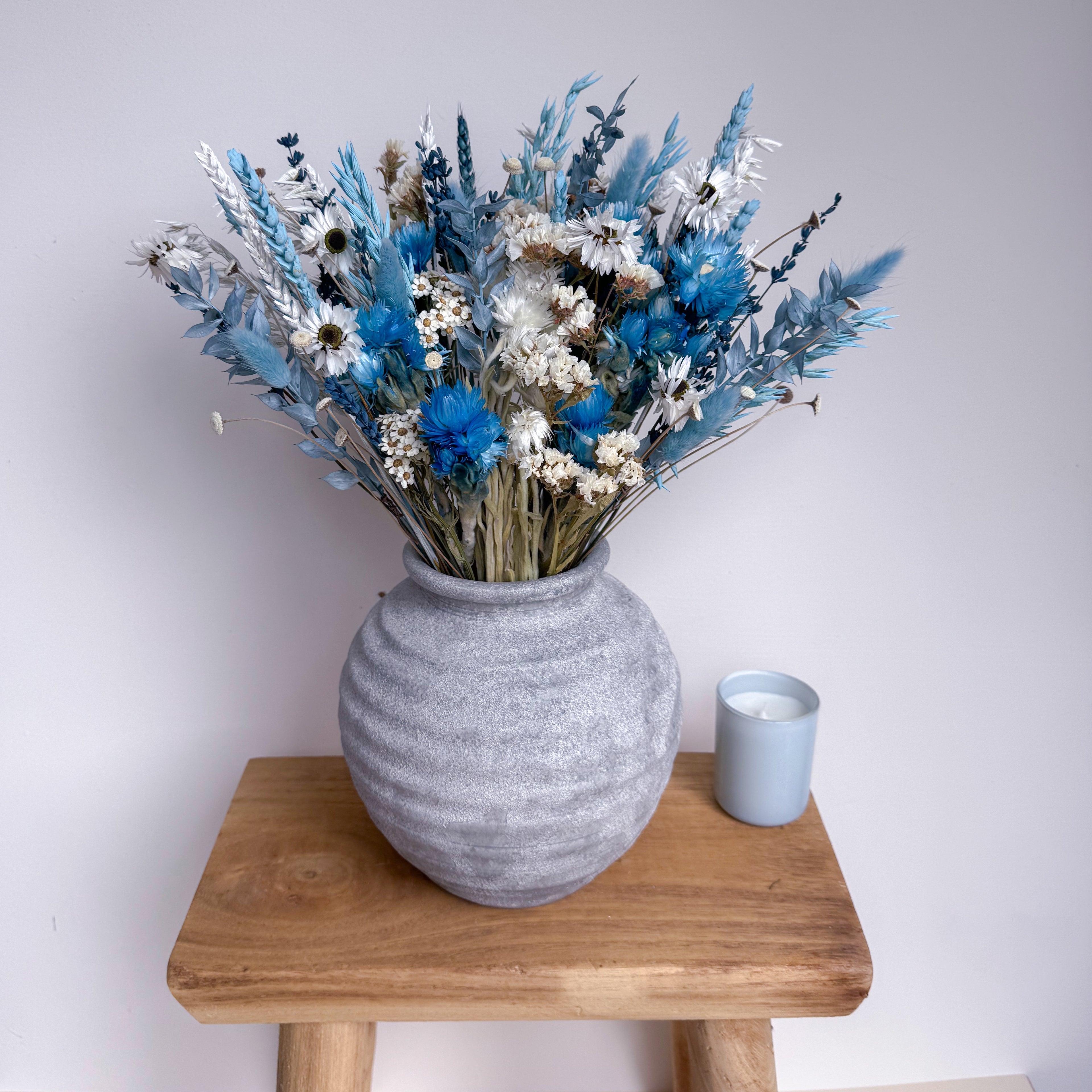 blue and white dried daisy bouquet