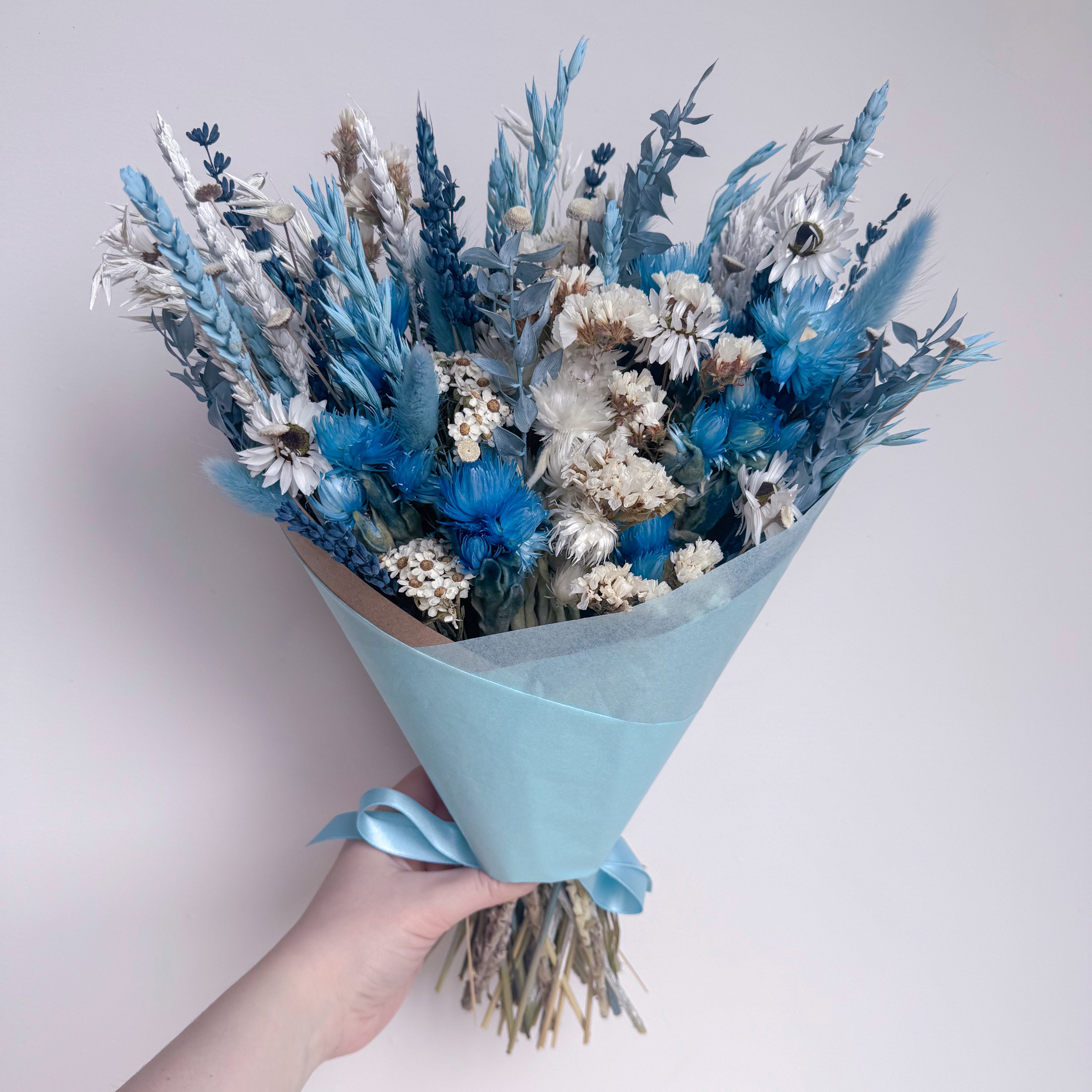 mixed blue dried flower arrangement