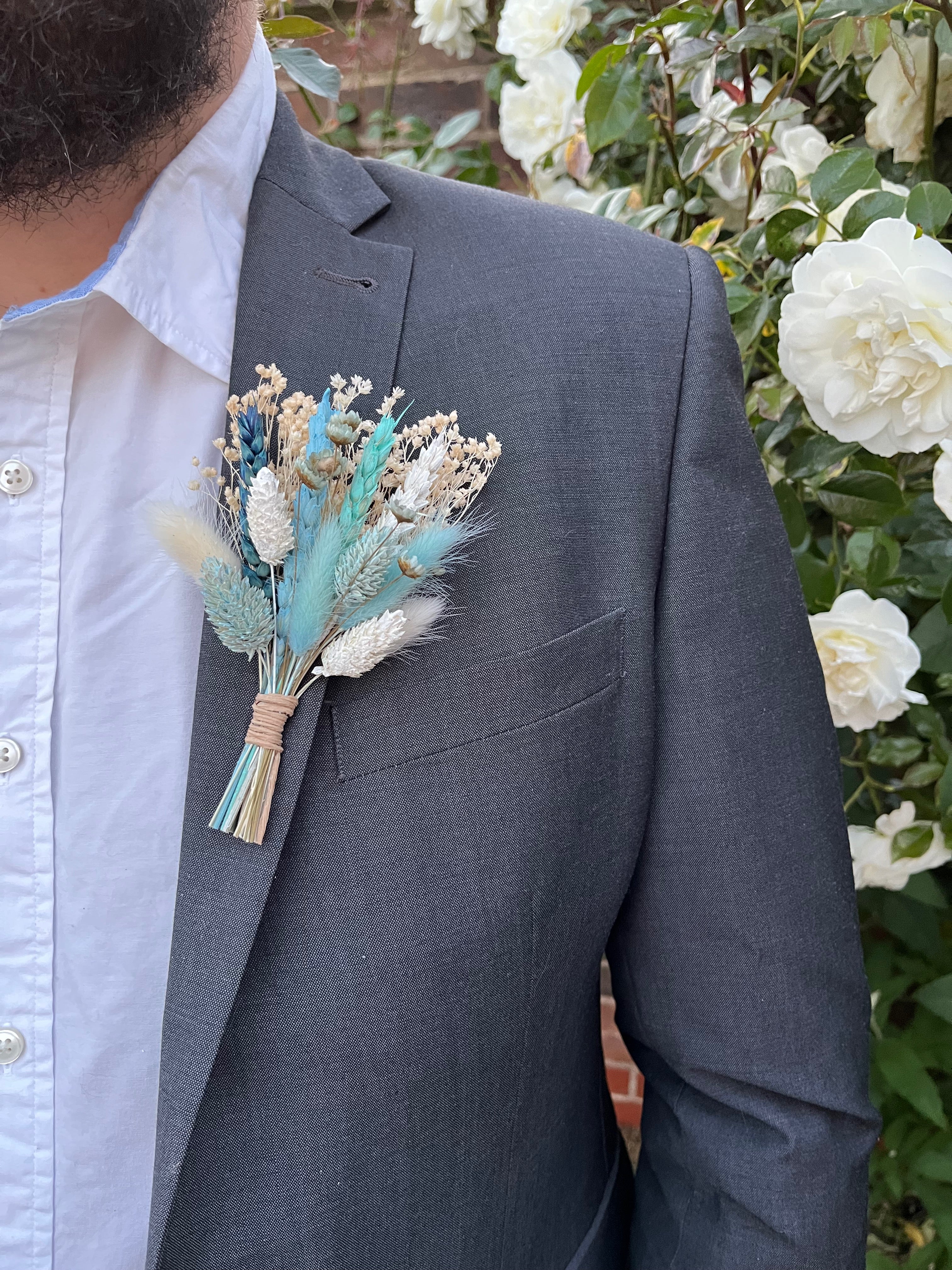 groom buttonhole in blue and white