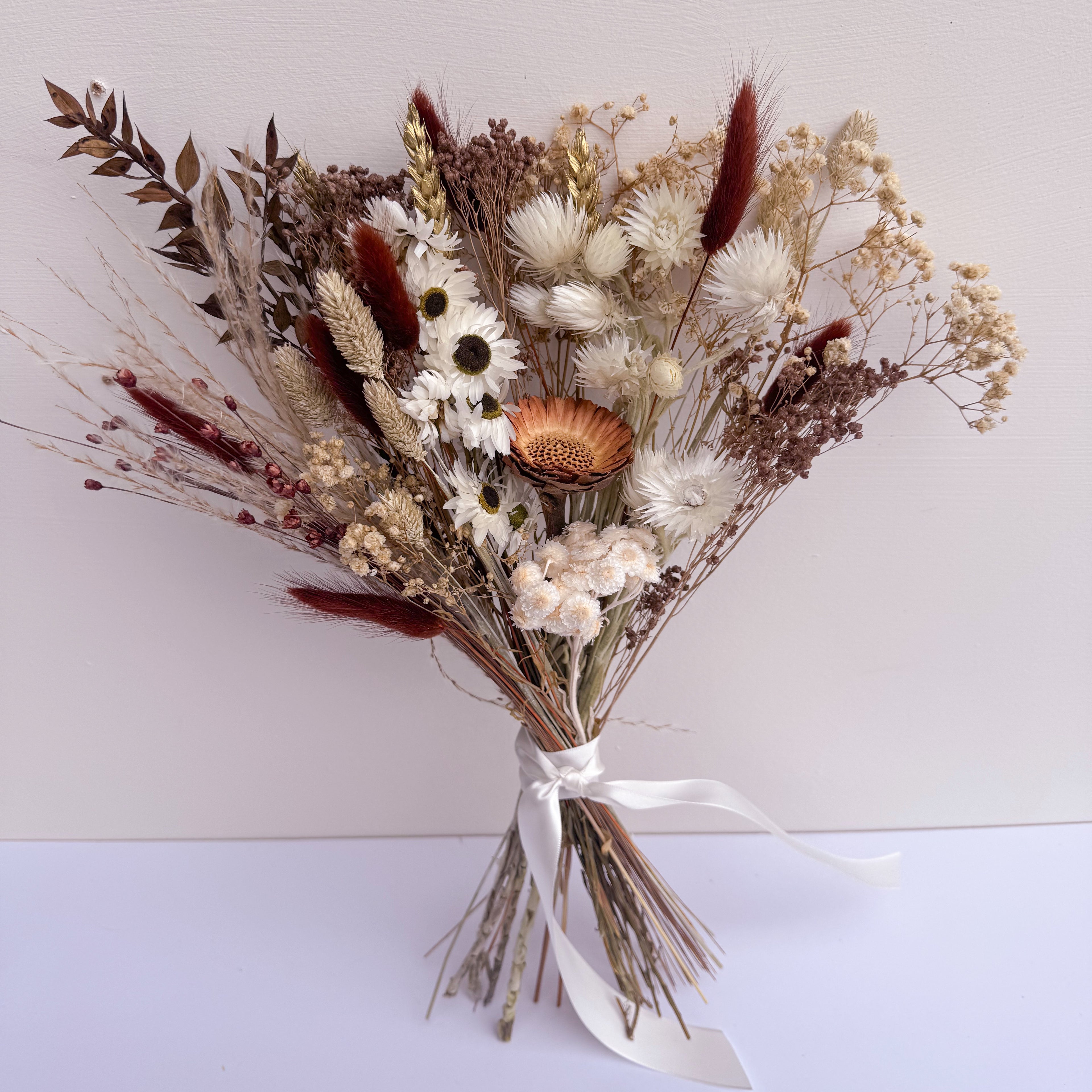 chocolate brown dried flower arrangement