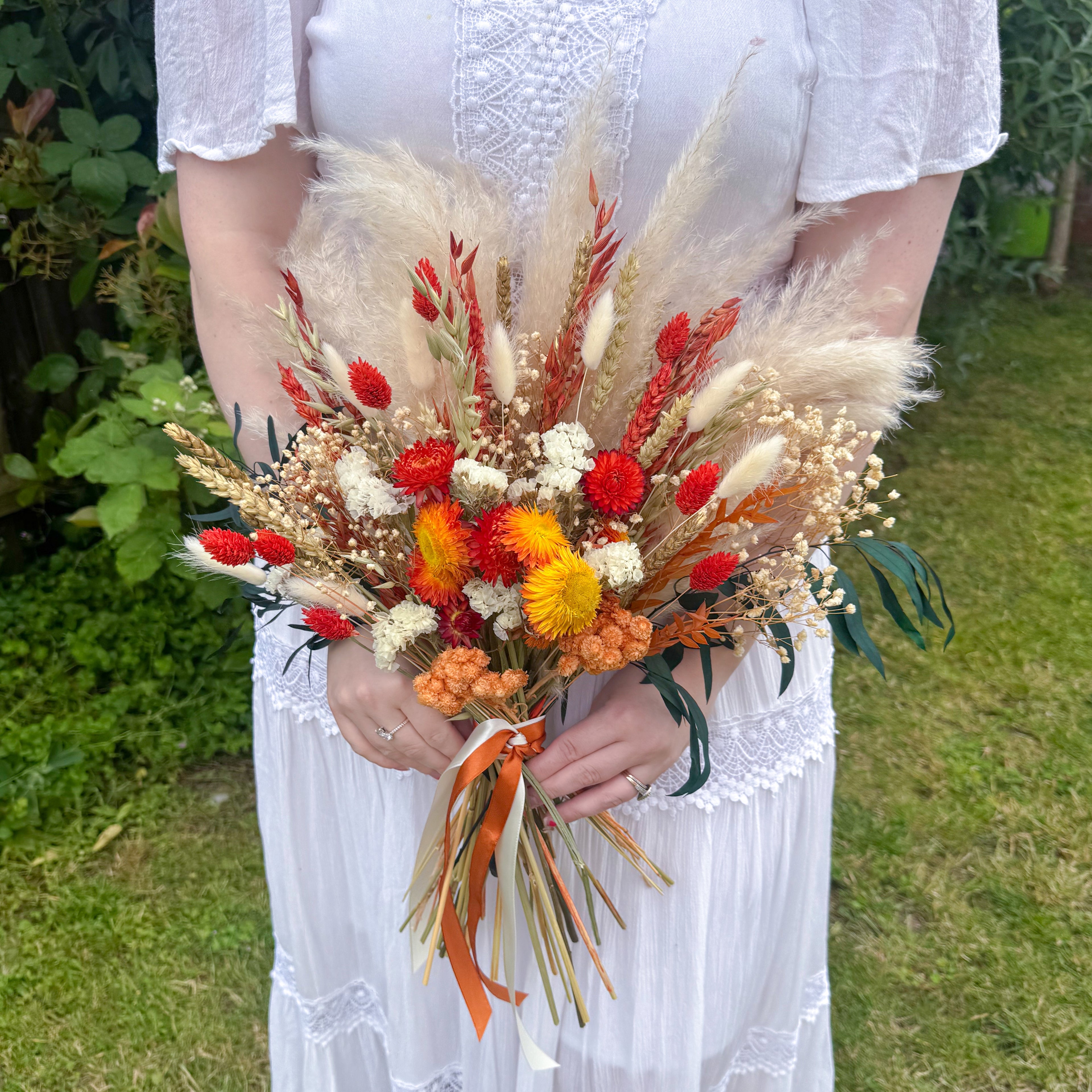 burnt orange helichrysum pampas grass bouquet