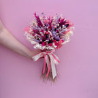 round pink and purple dried flower bouquet