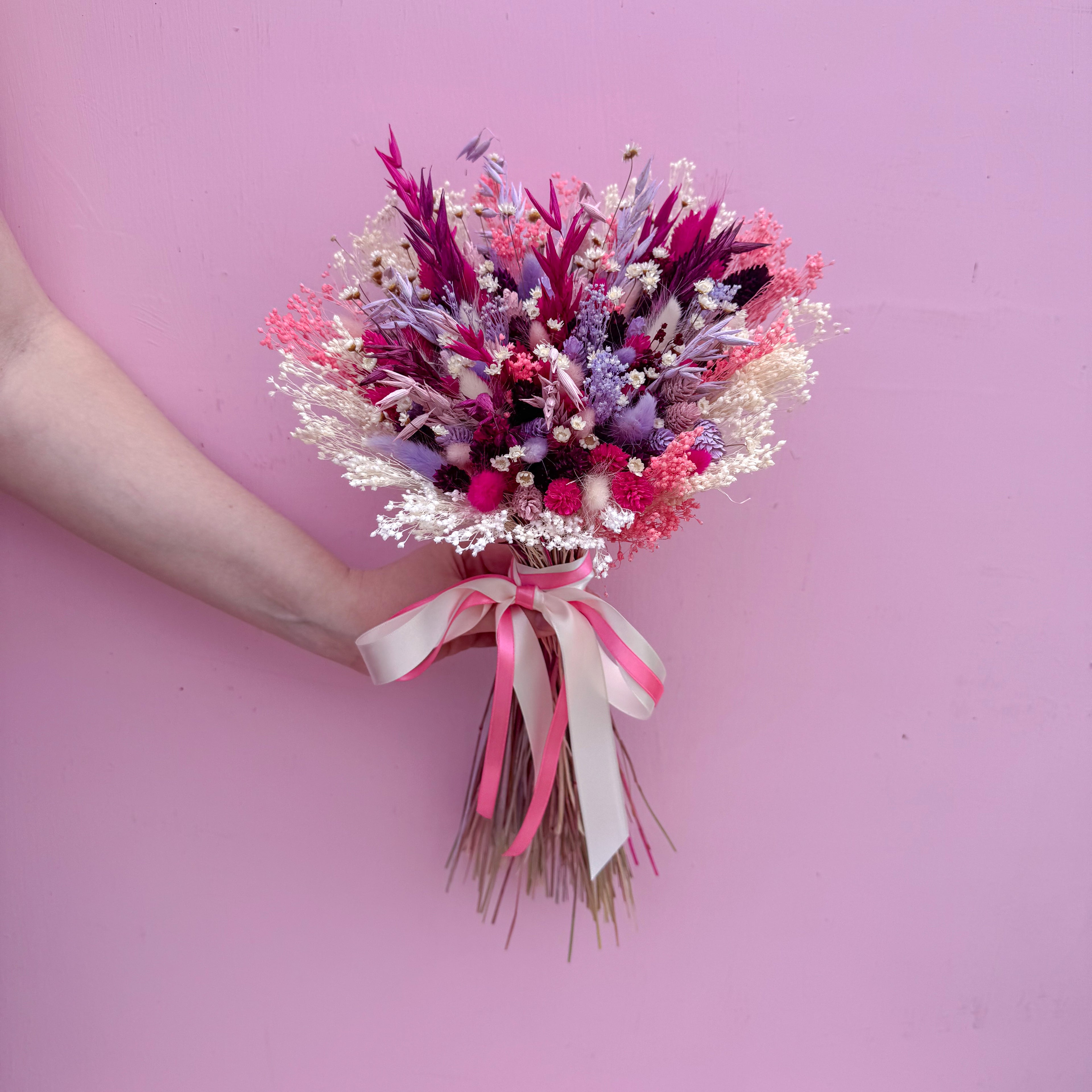 round pink and purple dried flower bouquet