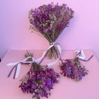 vibrant purple statice bouquet with ribbons