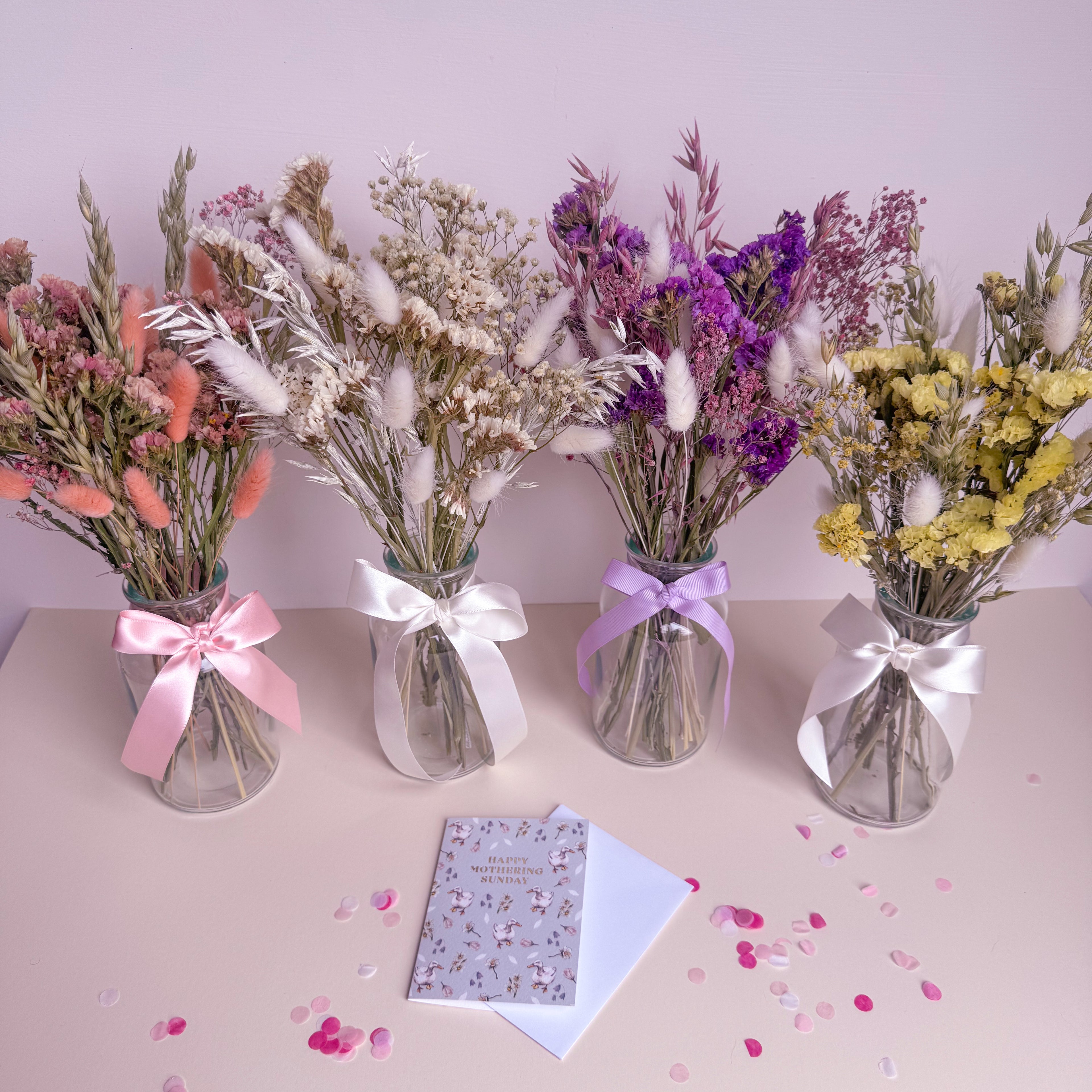 dried statice arrangement in glass vase with mothering sunday card
