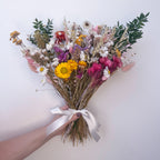 colourful wildflower arrangement against a white background