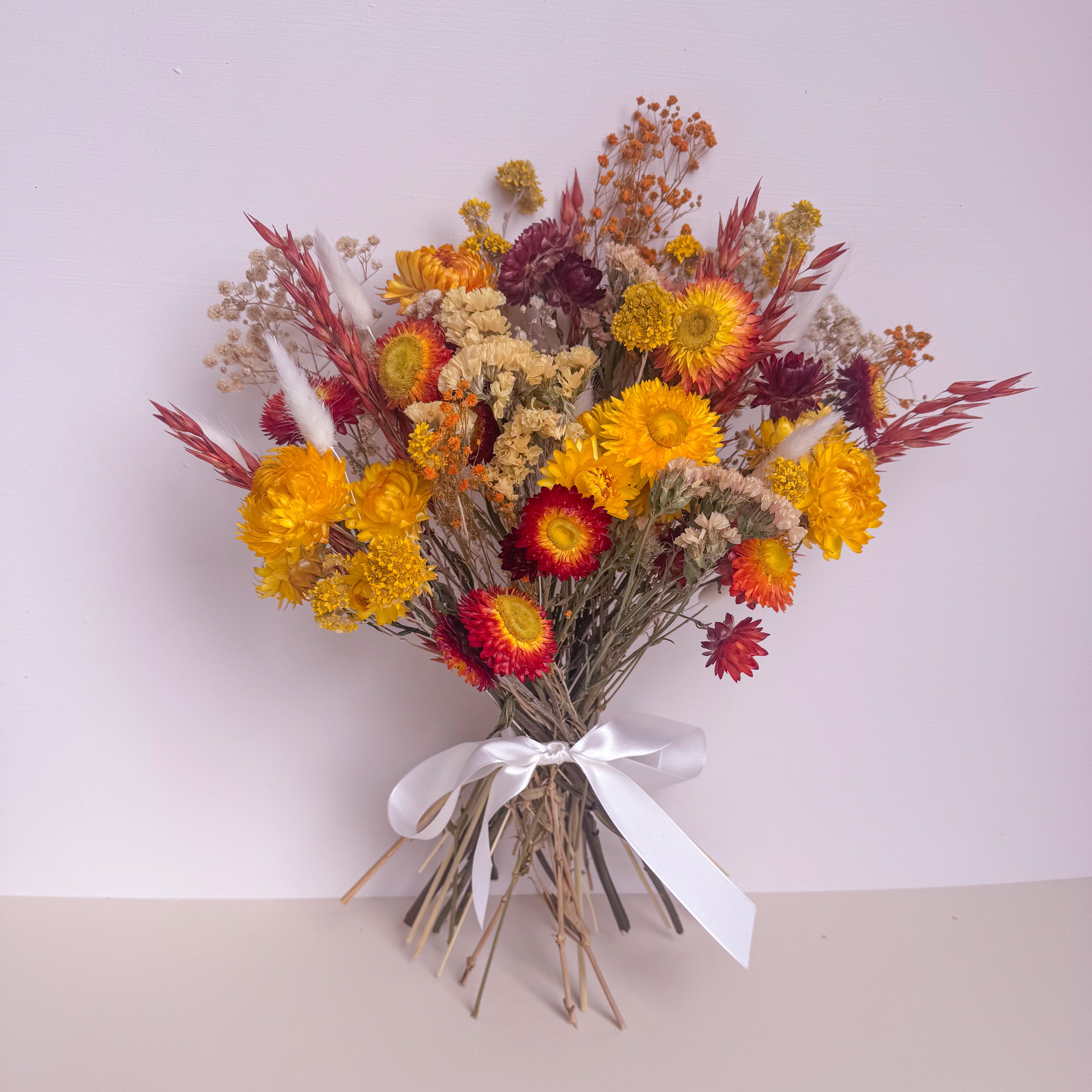 yellow and orange dried wildflower bouquet with babies breath