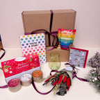 Gifting set with a card, popcorn, candles, and other items for Christmas