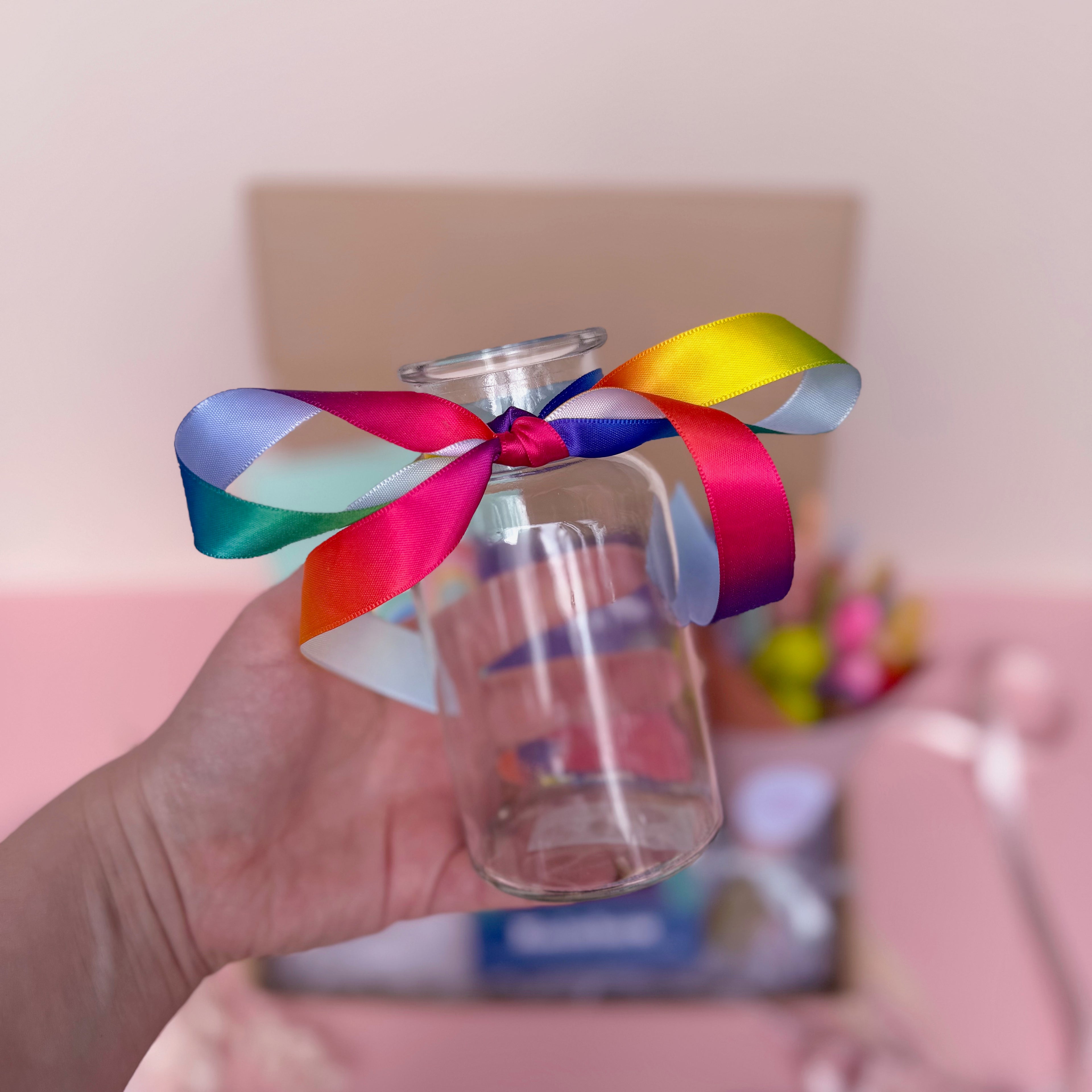 glass vase with rainbow ribbon
