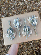 grey and white dried flower buttonhole
