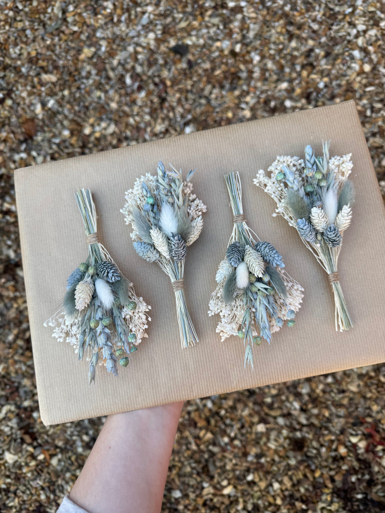 grey and white dried flower buttonhole