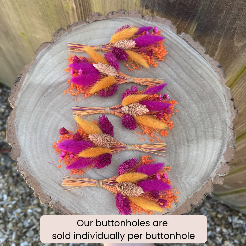 bright and colourful dried flower boutonniere in cerise and orange