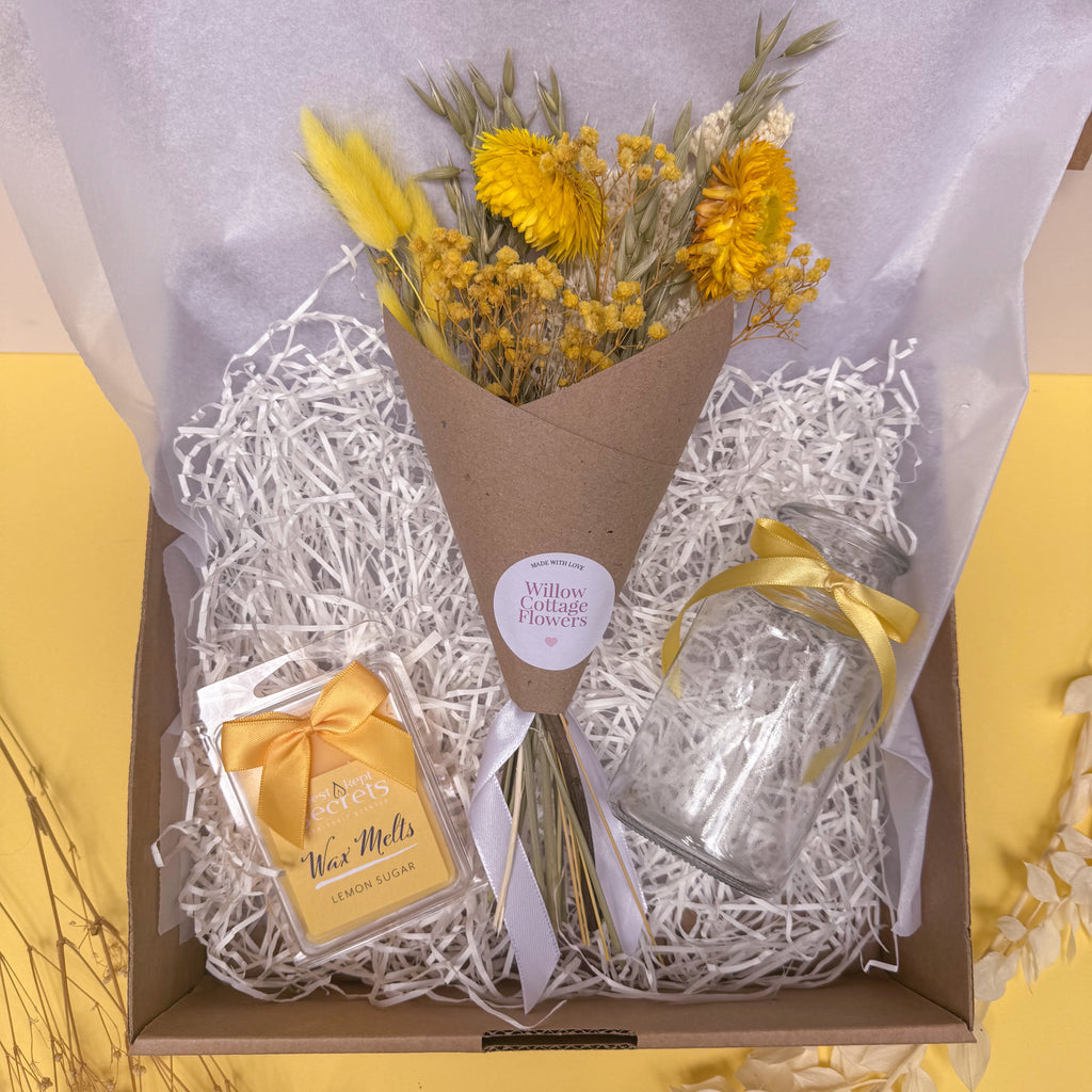 Gift set with flowers, wax melts, and a vase in a lemon theme