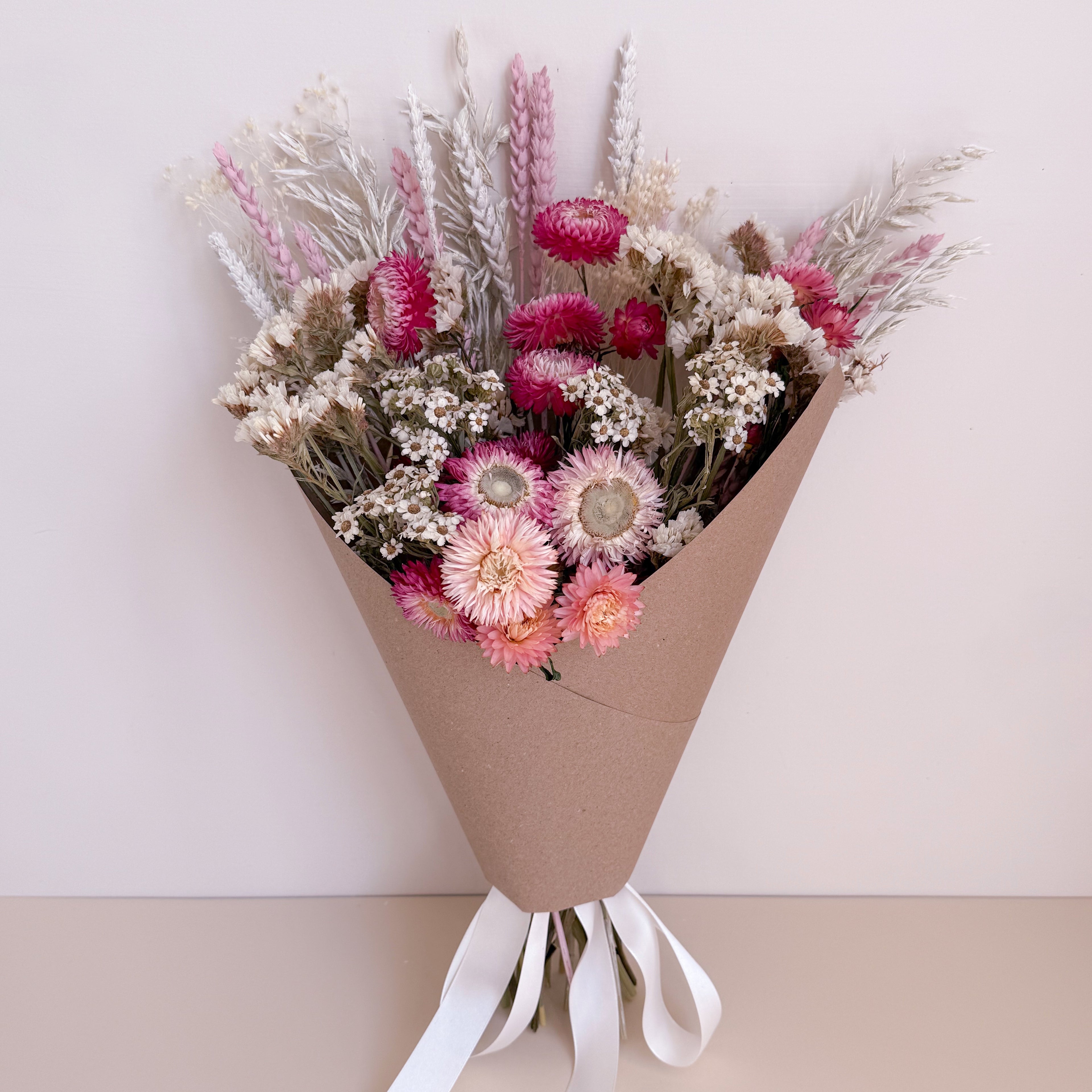 pink and white dried daisy bouquet