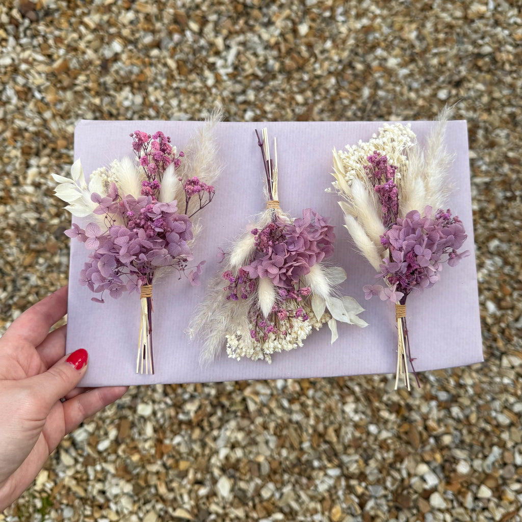 preserved hydrangea luxury buttonhole on purple background