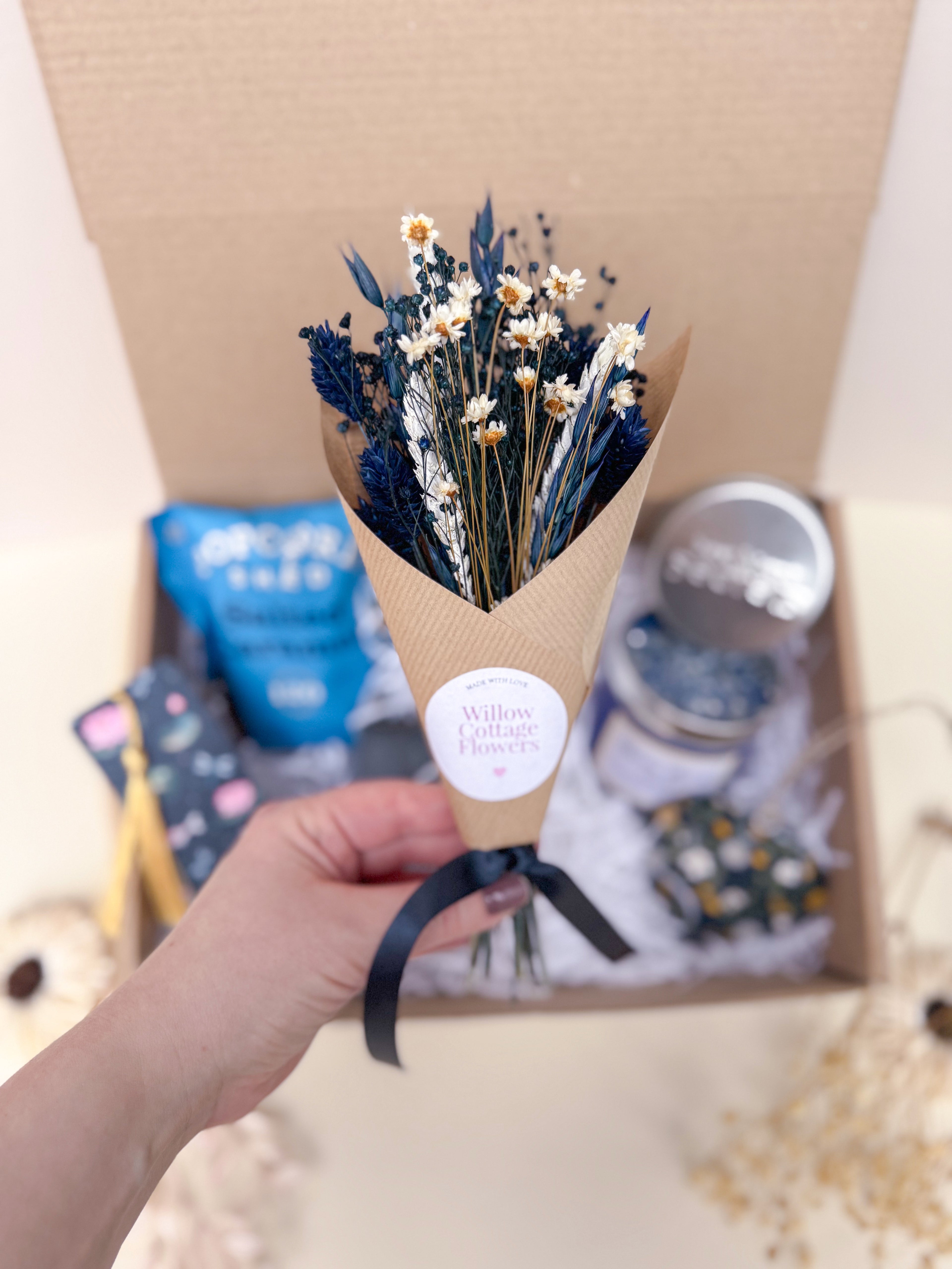 mini bouquet of small navy blue dried flowers