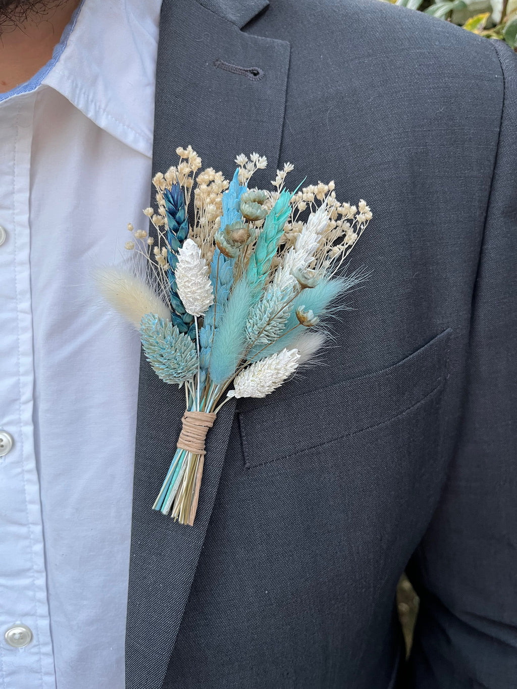blue dried flower buttonhole with wheat