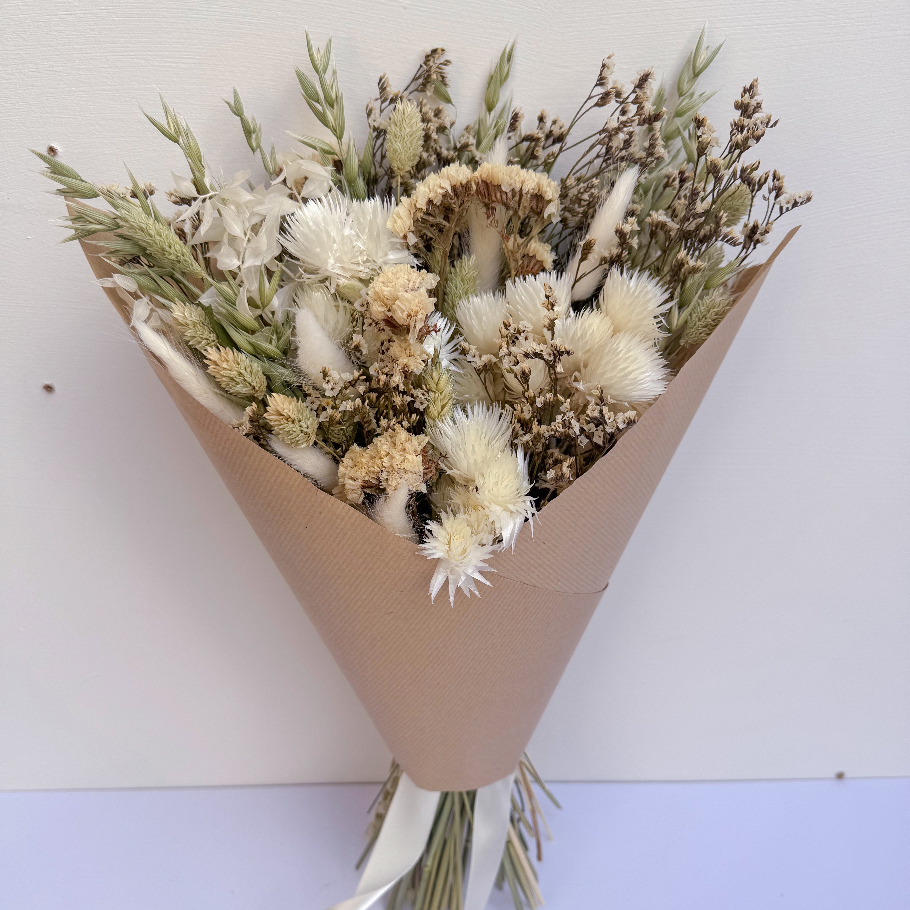 rustic boho dried flowers wrapped in brown paper