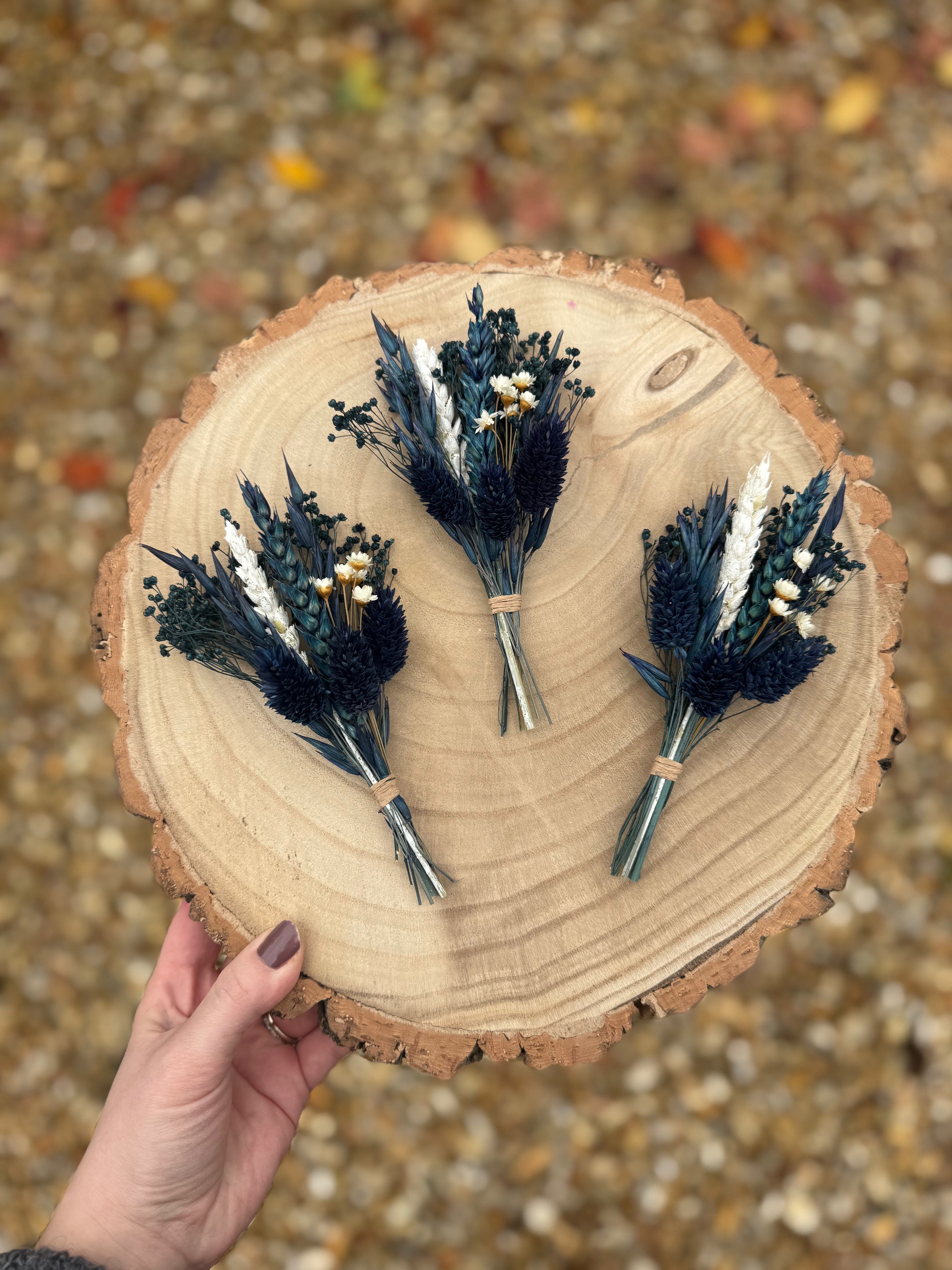 dark blue floral boutonniere for groom