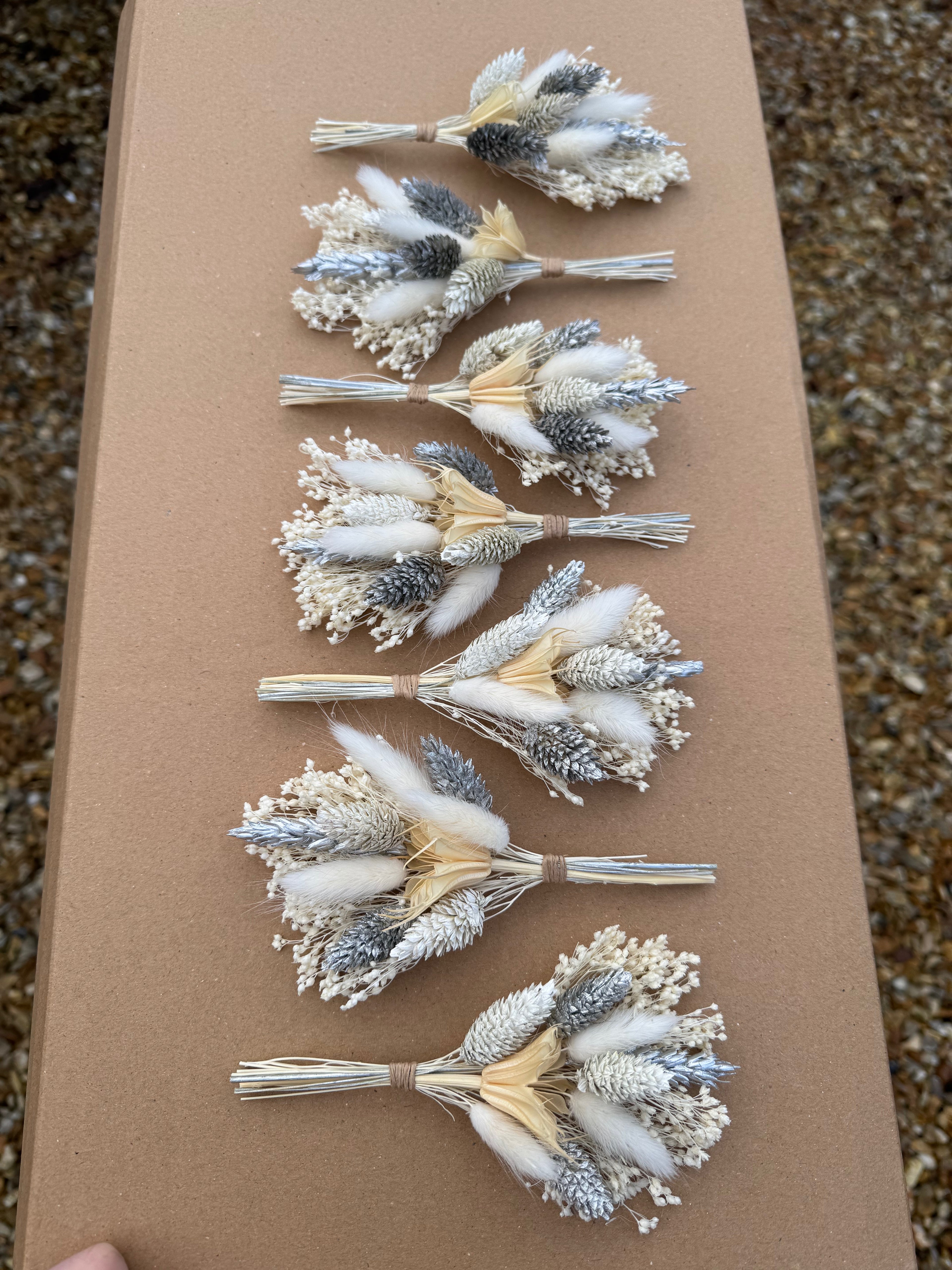 traditional floral buttonhole with silver