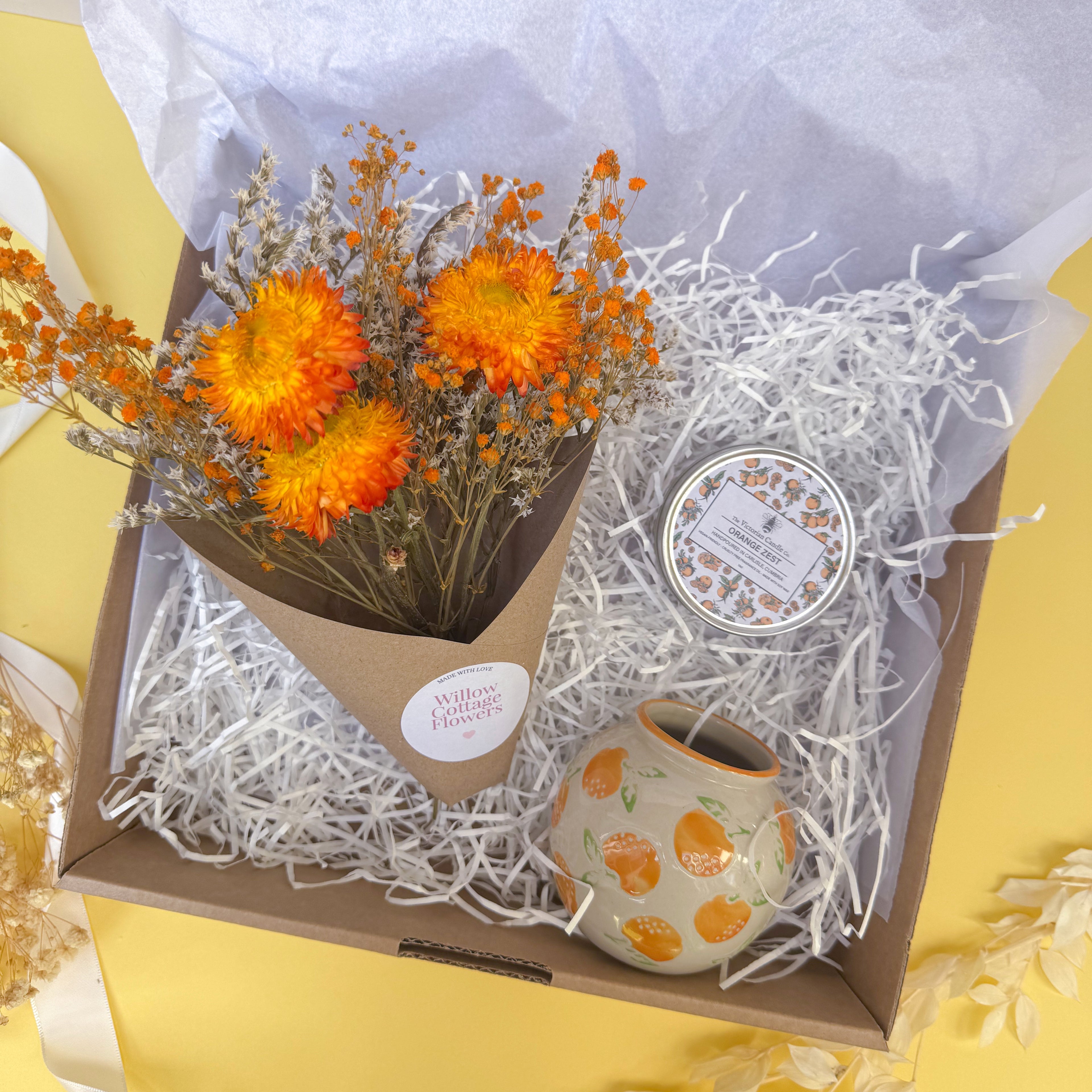 small orange themed gift box with candle