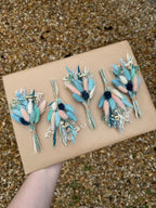 pink and blue grooms floral pins