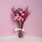 small bouquet of pink dried flowers with pink daisies