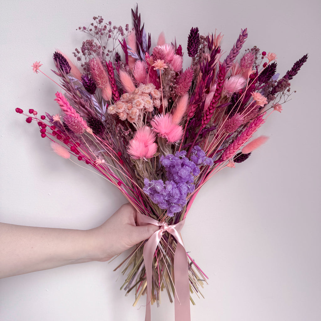 vibrant pink dried flower bouquet with helichrysum