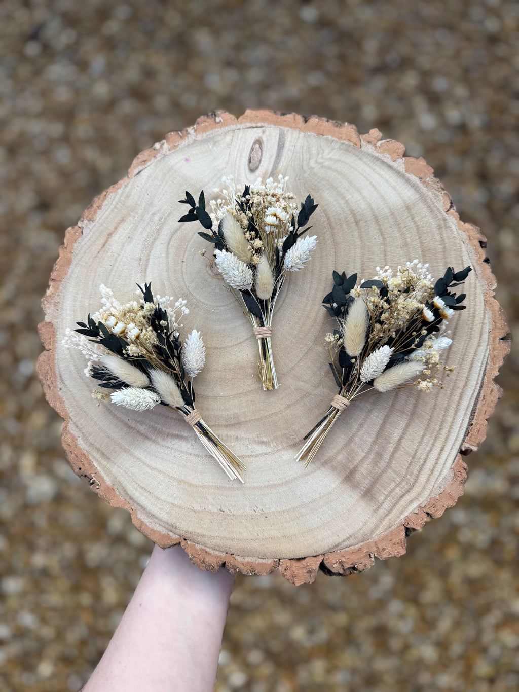 dark green foliage buttonhole with gypsophila