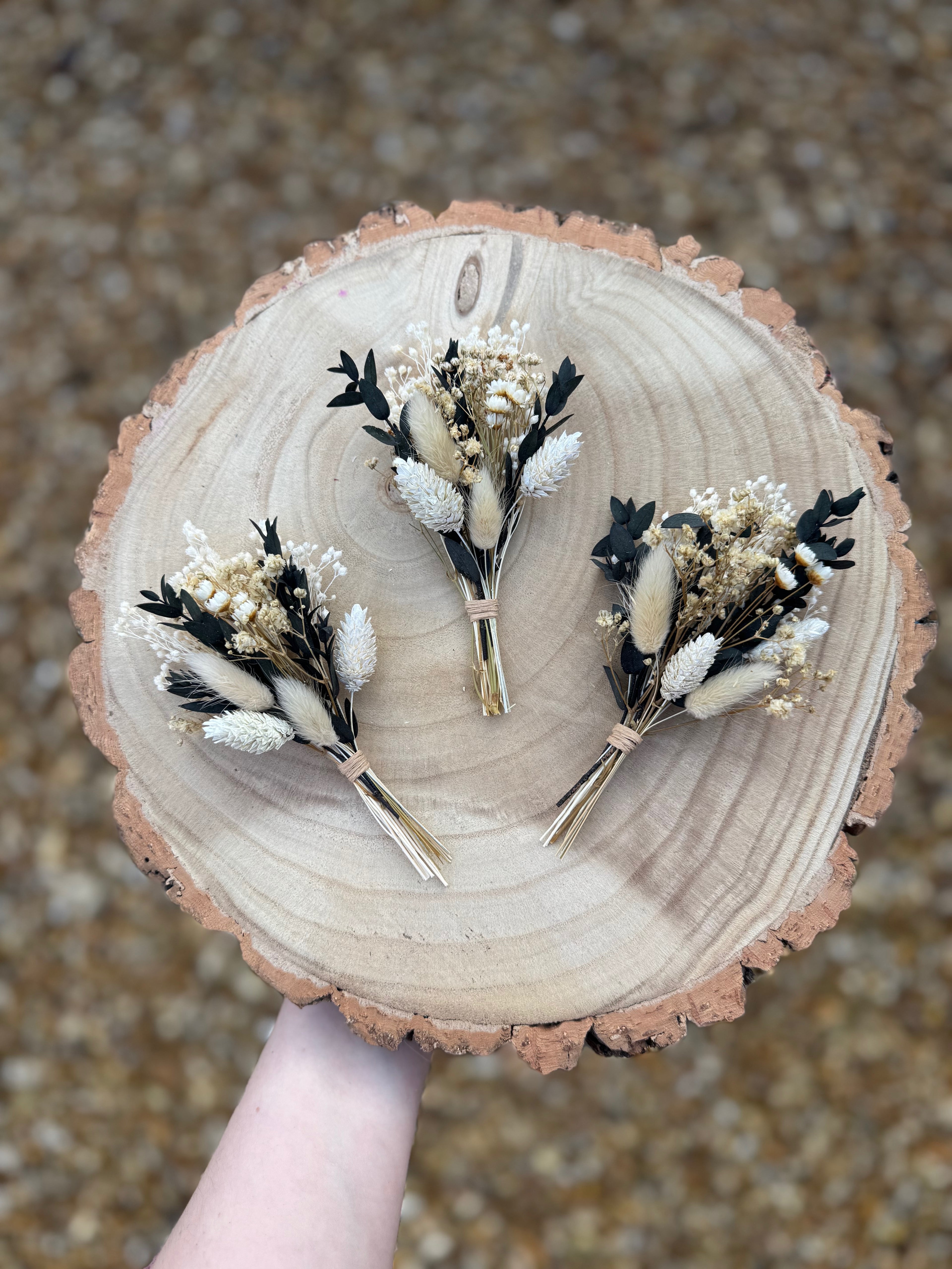dark green foliage buttonhole with gypsophila