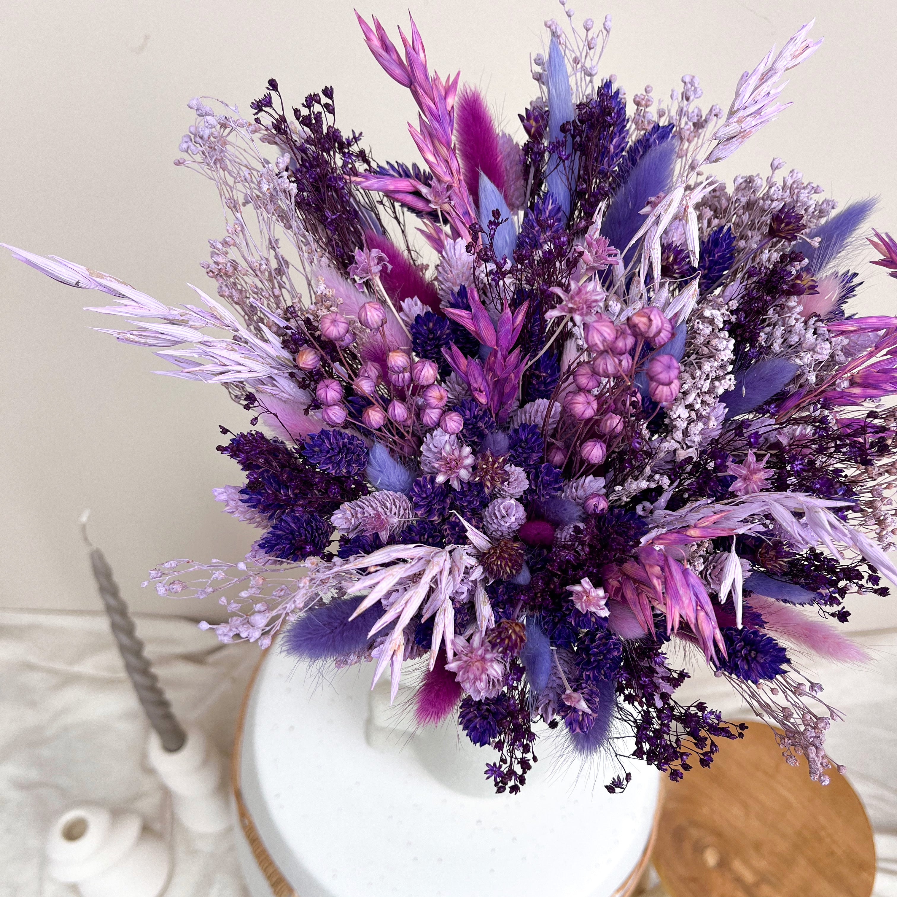 lilac and dark purple dried flower wedding arrangement