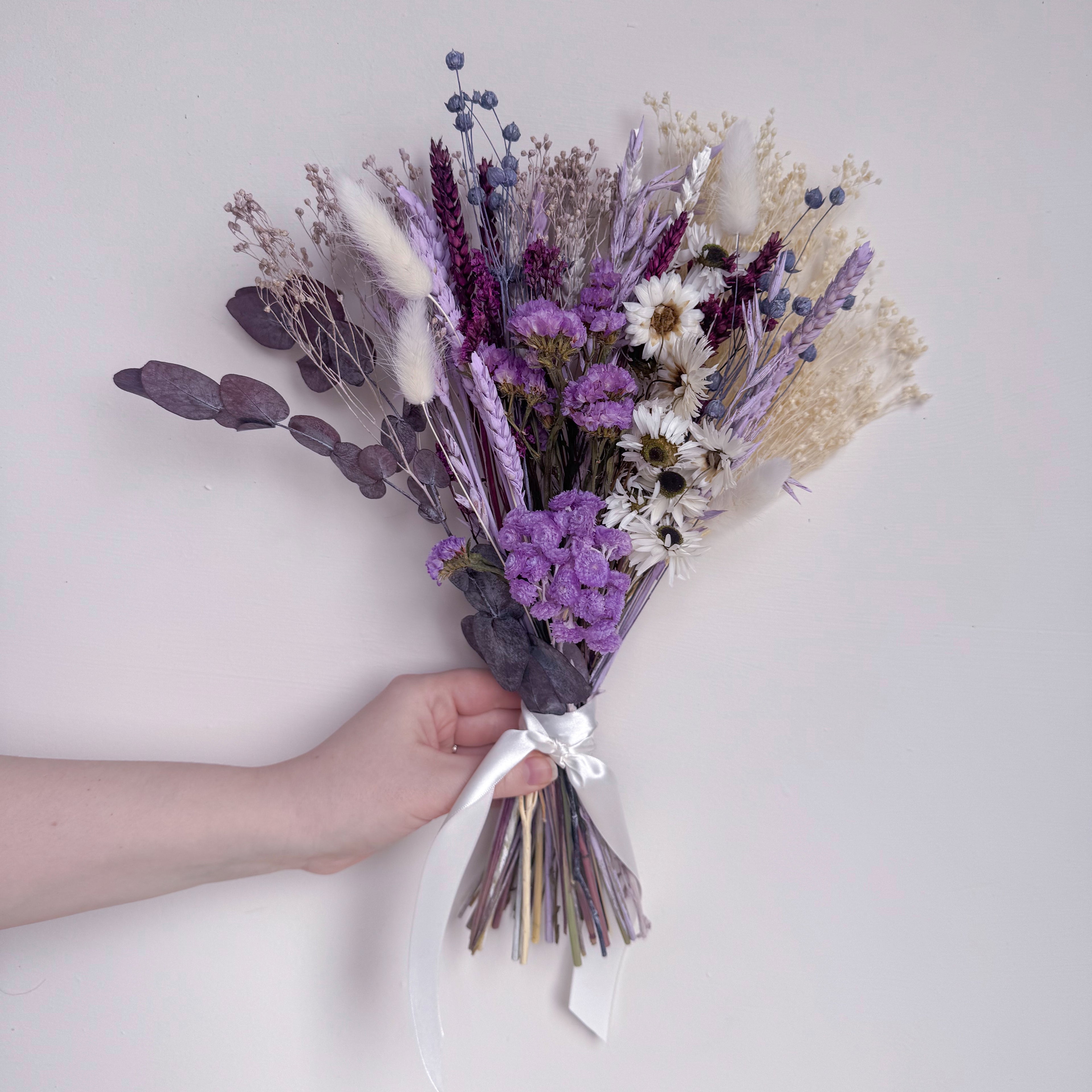 small bunch of purple and white dried flowers