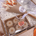 a gift box of 6 mini white pumpkin tea light candles