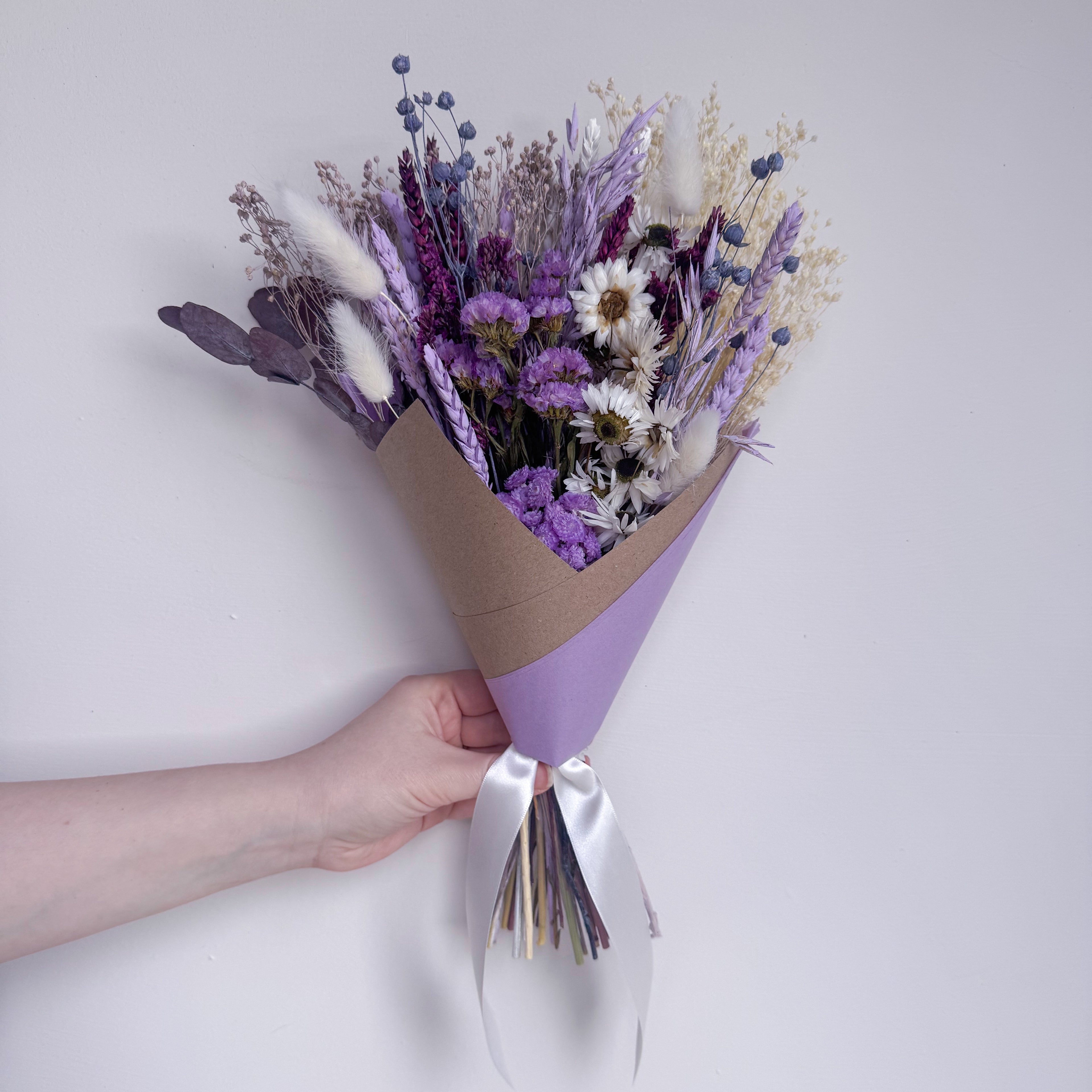 small lilac daisy bouquet with purple dried flowers