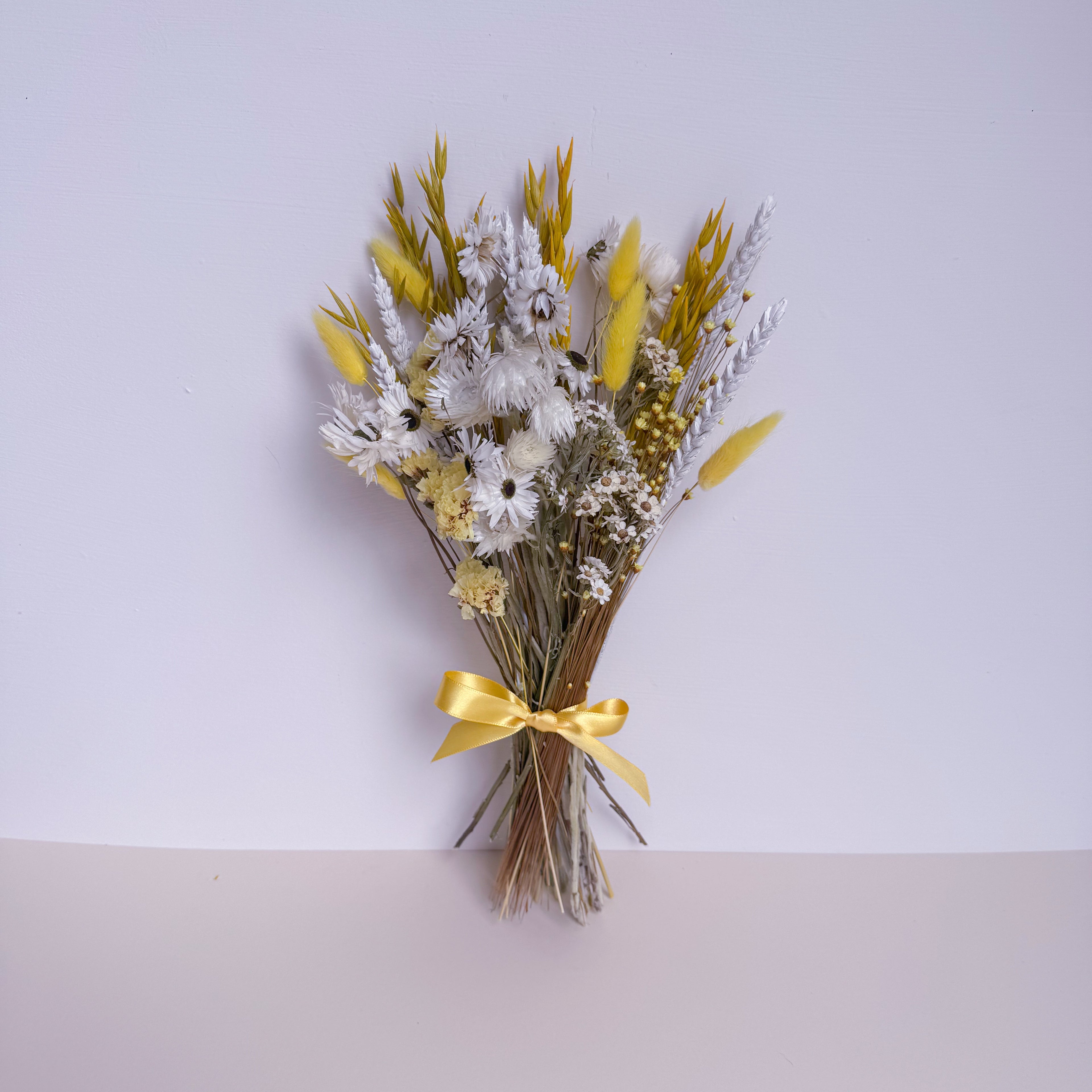 dried daisy bouquet in yellow and white
