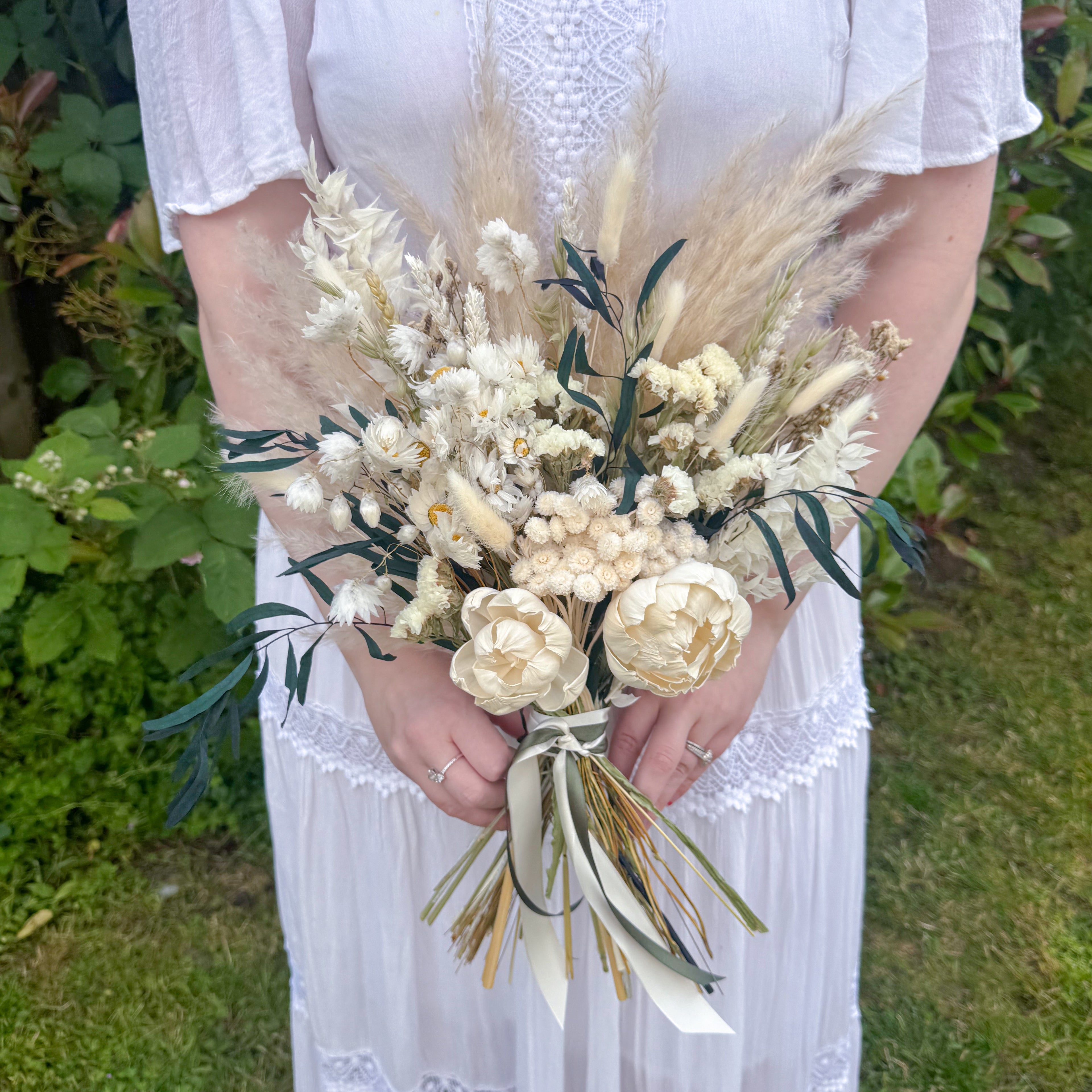 luxury white dried flower wedding bouquet with grasses