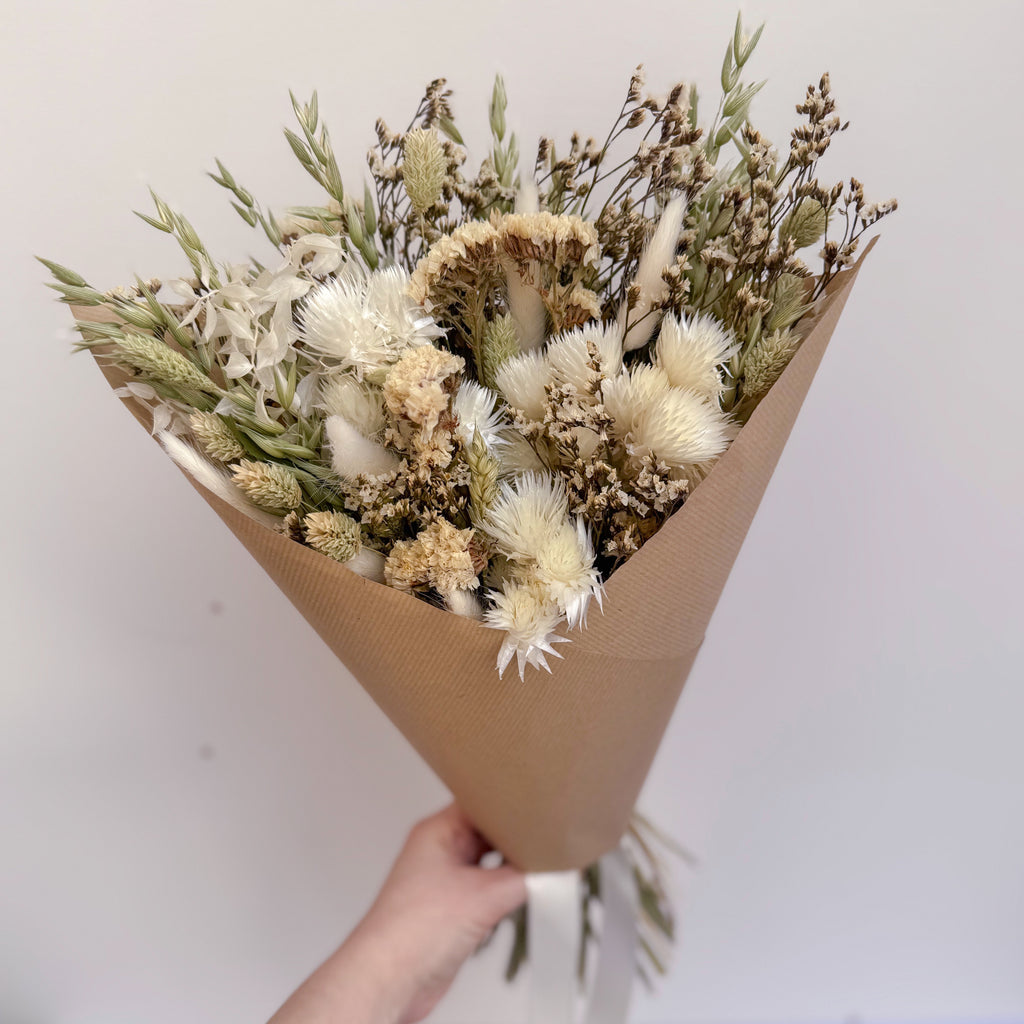 luxury white dried flower bouquet with brown paper gift wrap