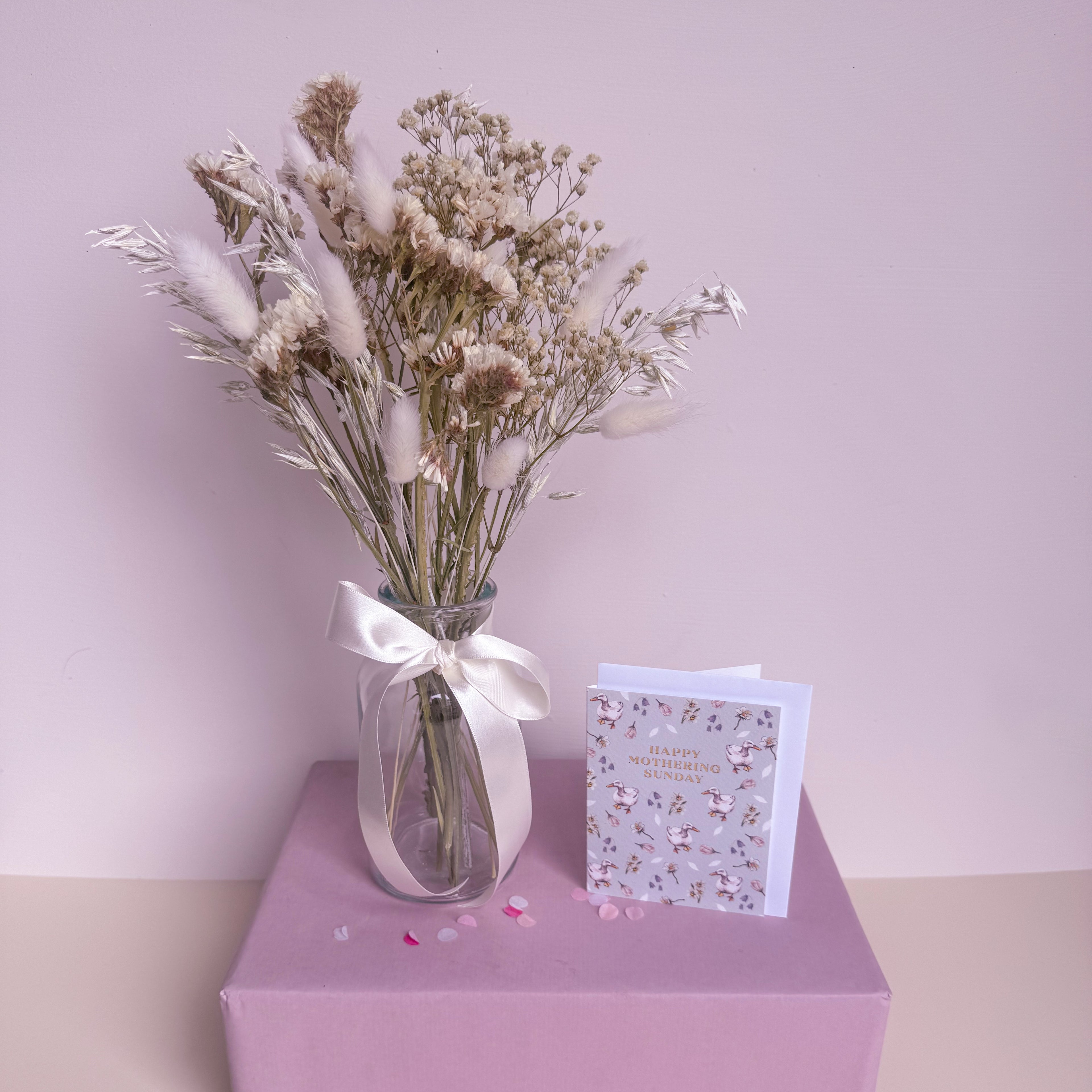 white statice bouquet with glass vase and mothers day card