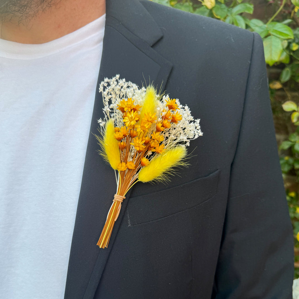 yellow and white dried flower buttonhole with bunny tails