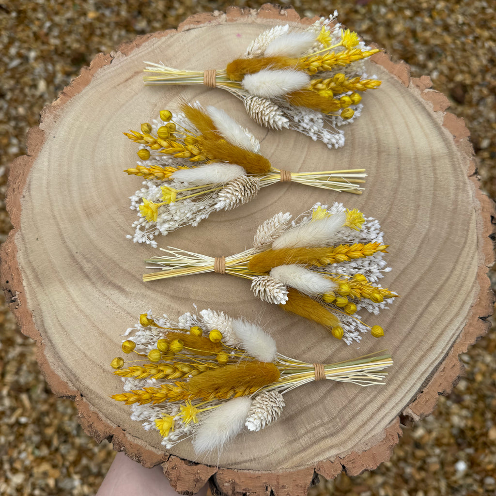 white and yellow floral boutonniere 