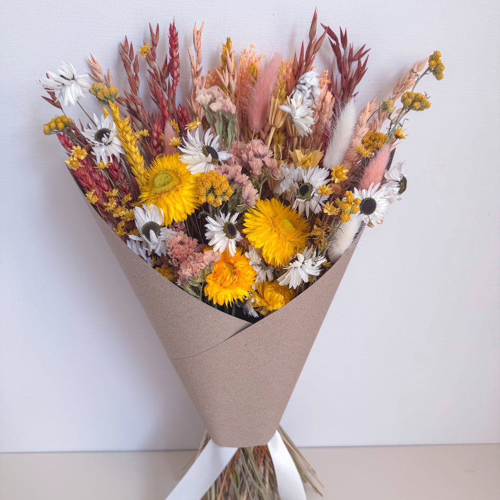 yellow dried daisy arrangement with wildflowers