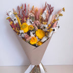 yellow dried daisy arrangement with wildflowers
